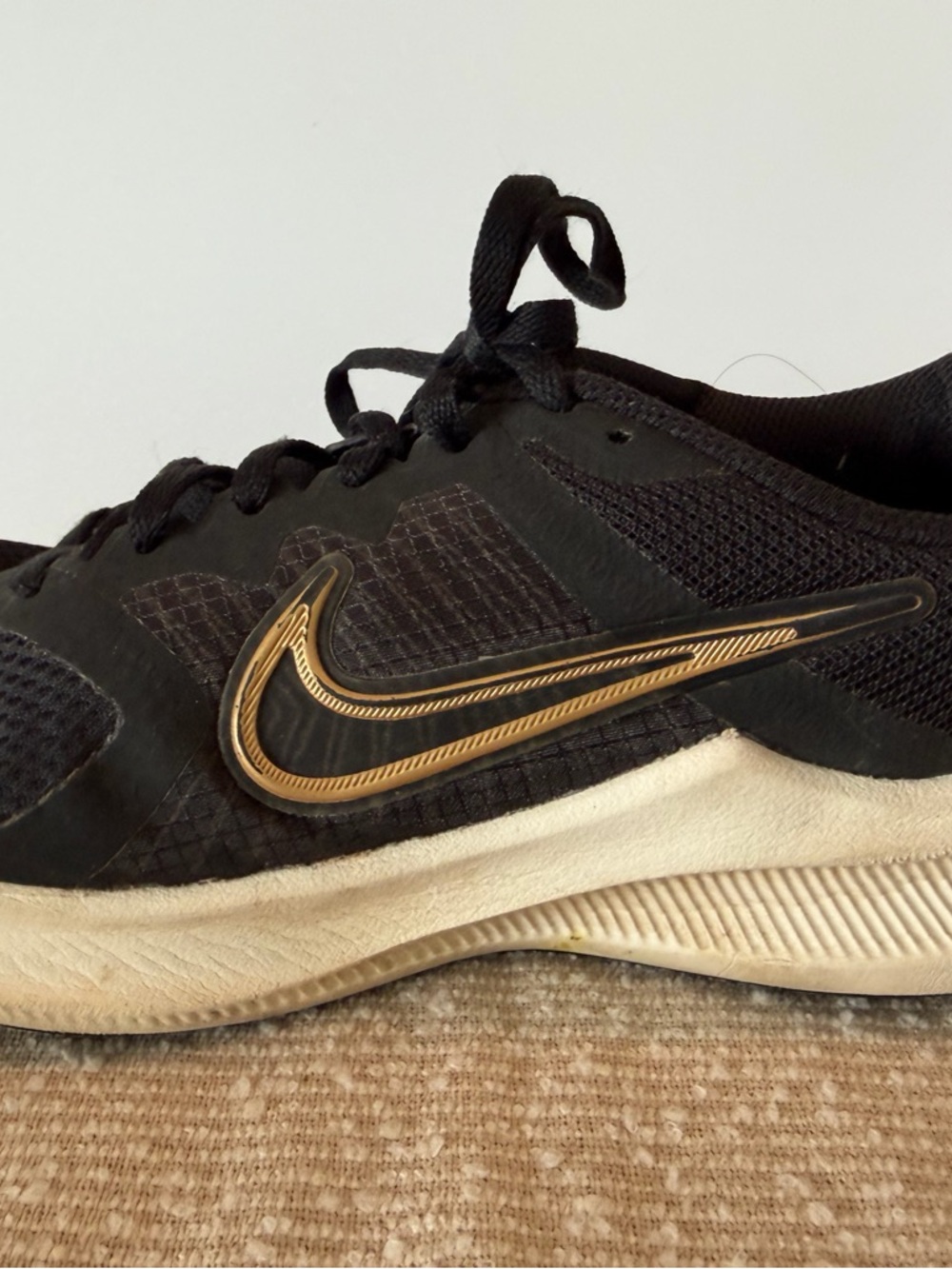 Nike Women’s Black and Gold Training Sneakers